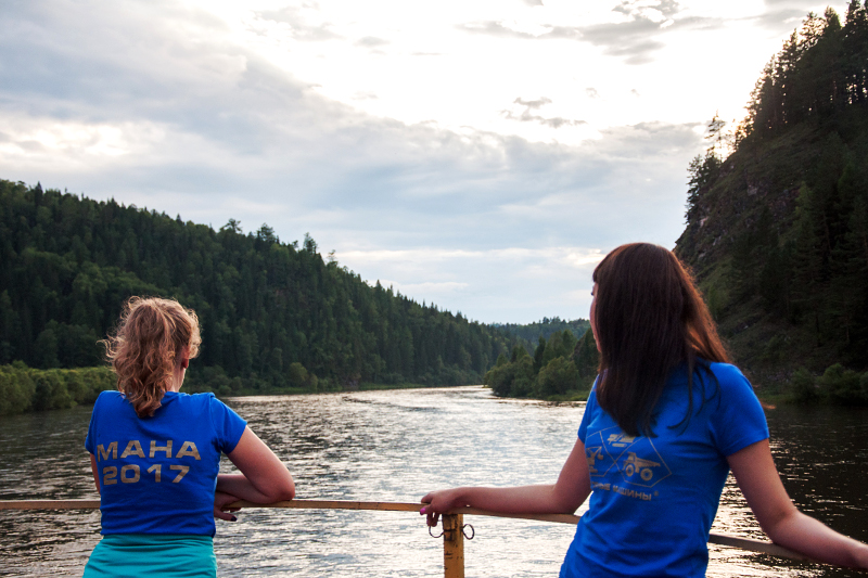 Girls and sunset on the river Mana
